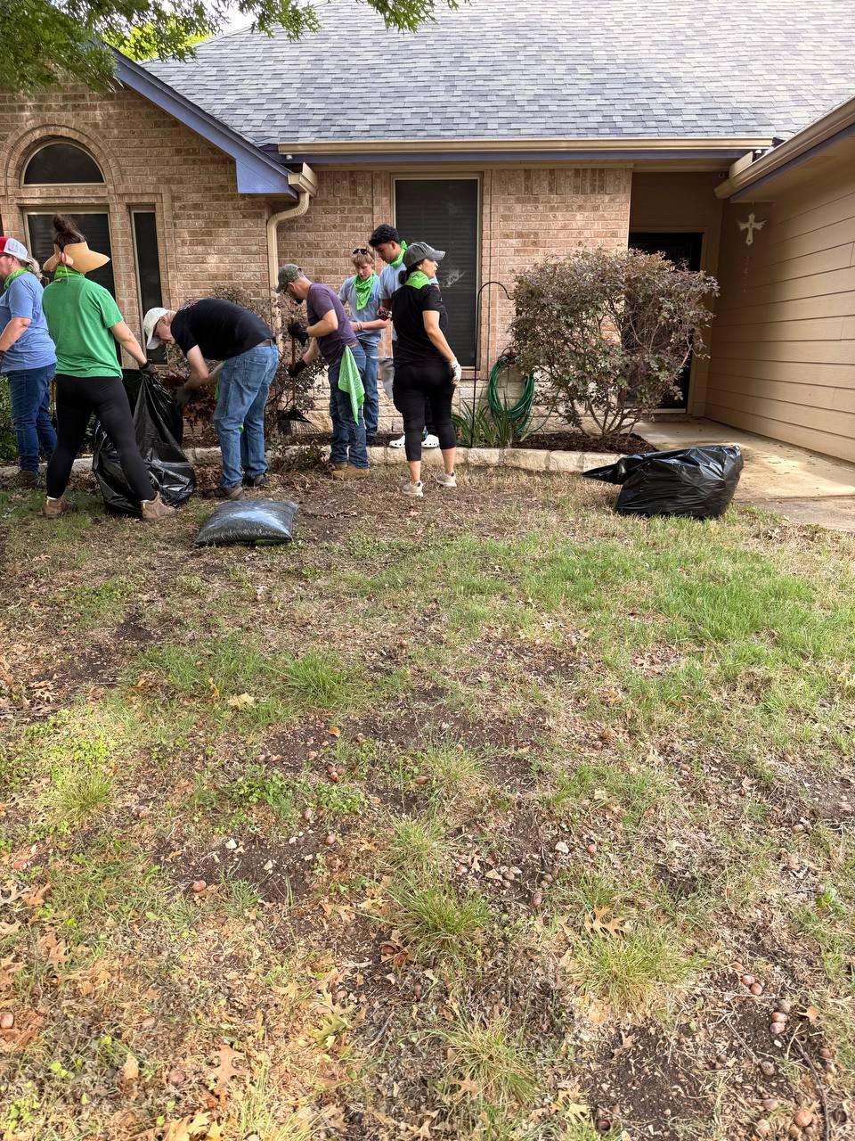 Roofer checking gutters for shingle granules after a Texas storm