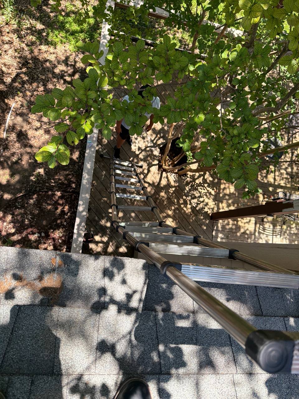 Hail-damaged roof being inspected for an insurance claim