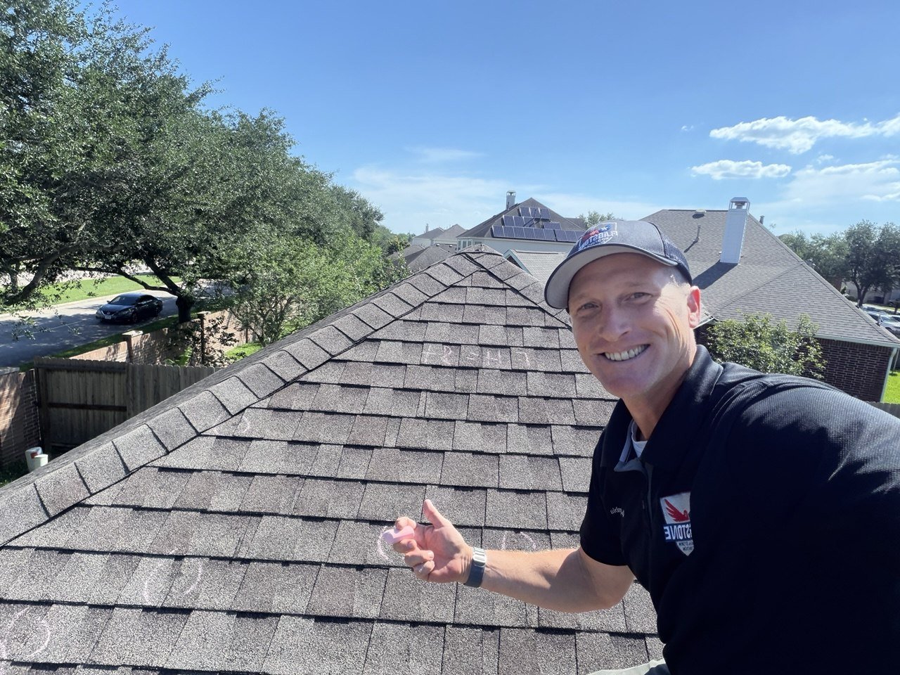 Insurance adjuster inspecting a storm-damaged Texas roof
