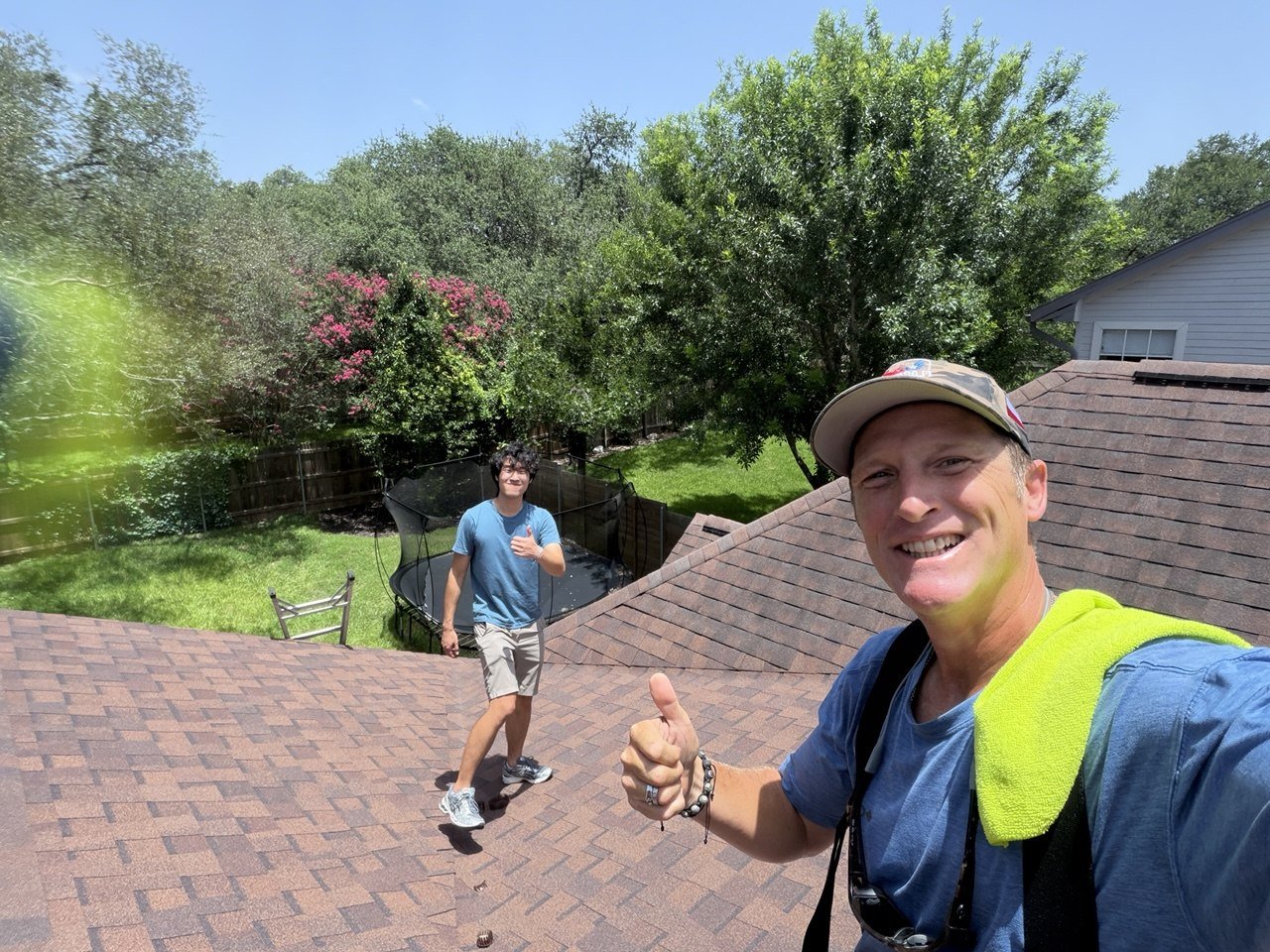 GAF certified roofer reviewing an estimate with a homeowner