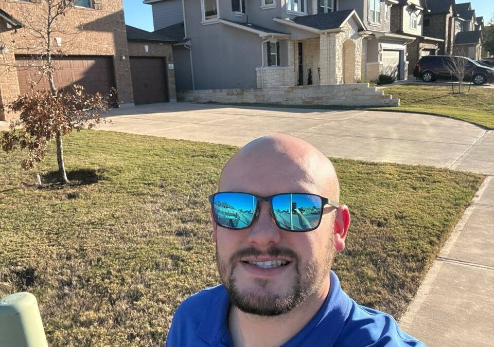 Flagstone Roofing inspector documenting hail damage on a Texas roof after a denied claim