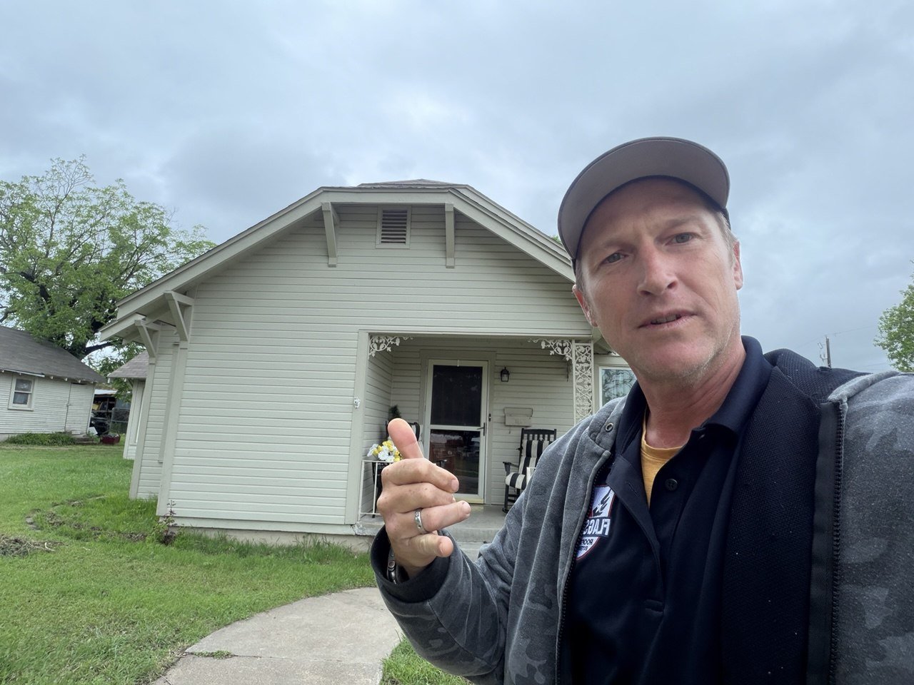 Roofer reviewing a warranty with a homeowner