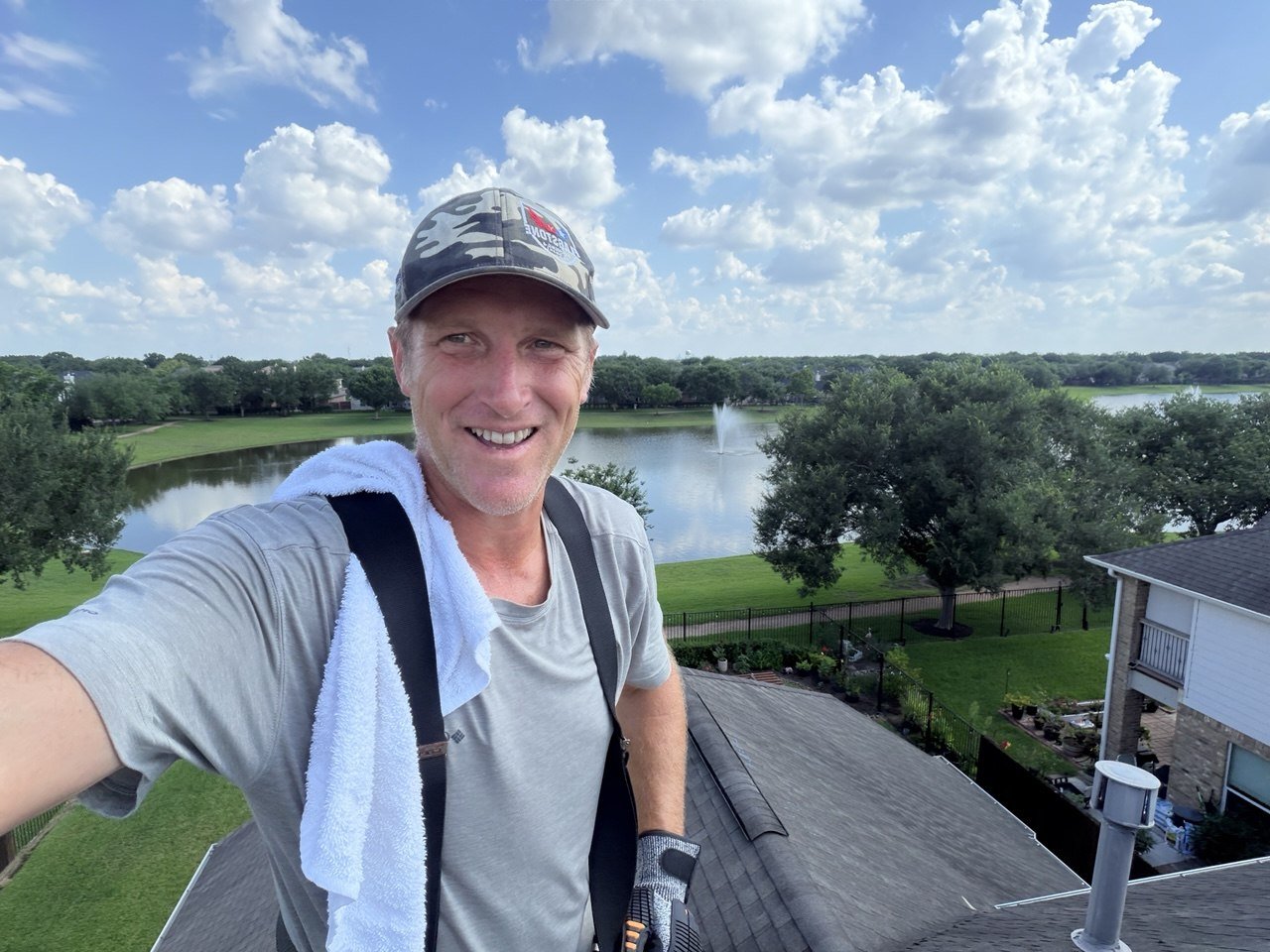 A roofing sales representative meeting with a client
