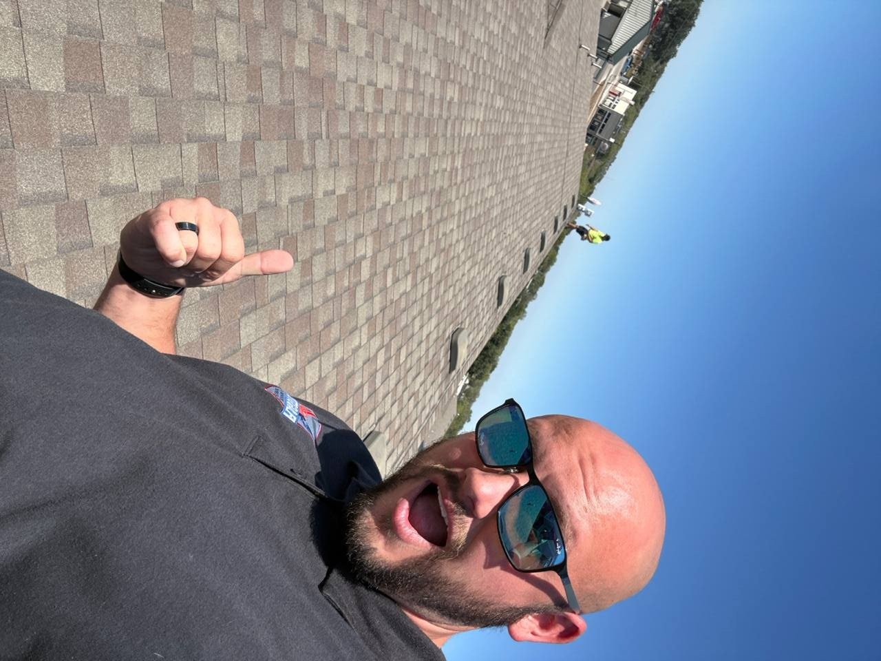 Flagstone Roofing inspector checking shingle granule loss