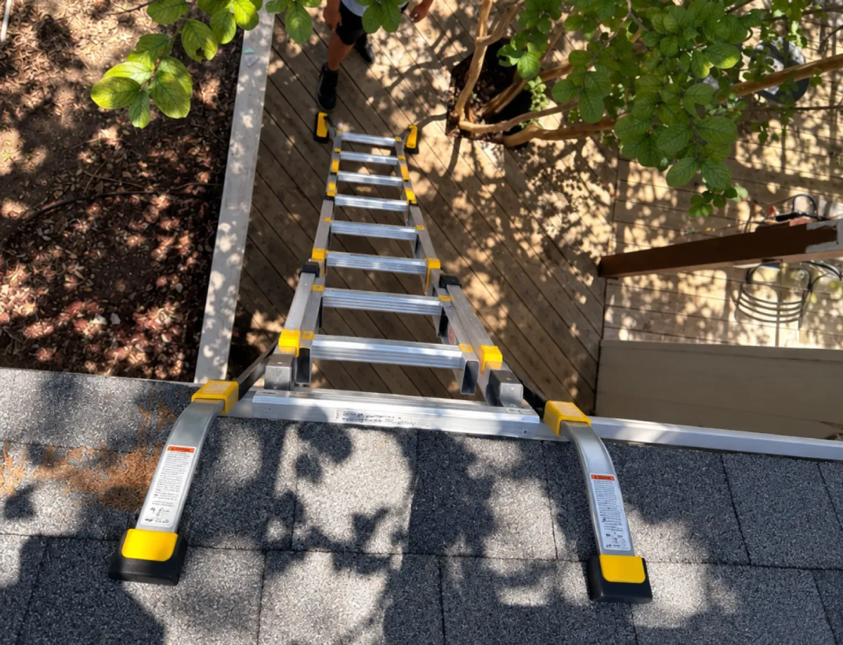 Hail-damaged roof being inspected for an insurance claim