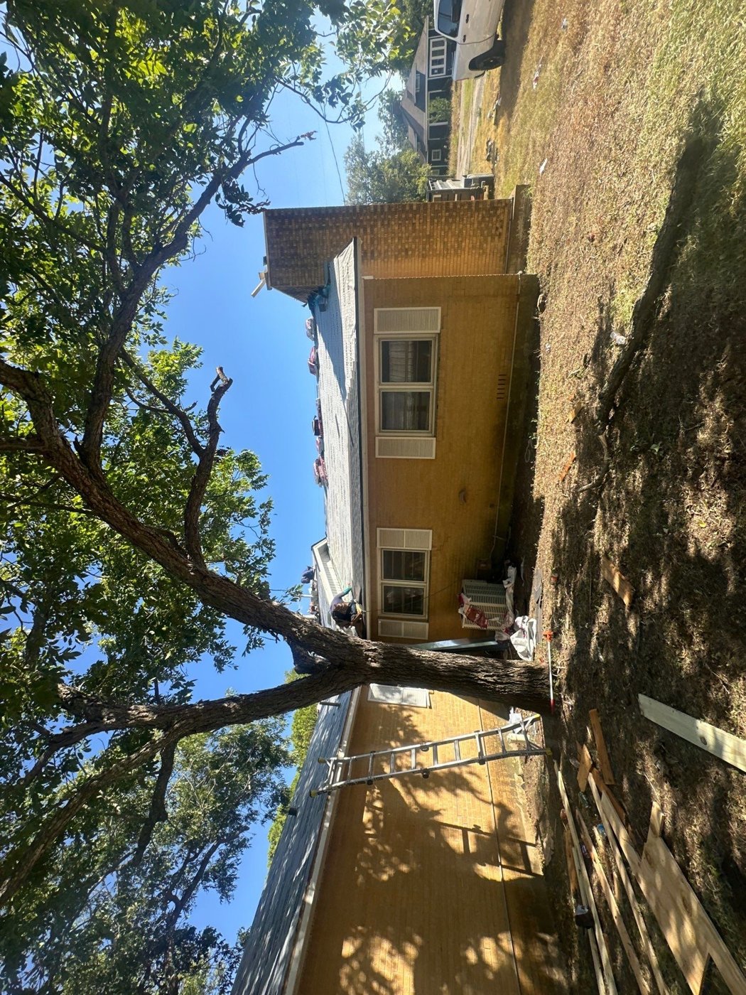 Professional roofer working on a house roof