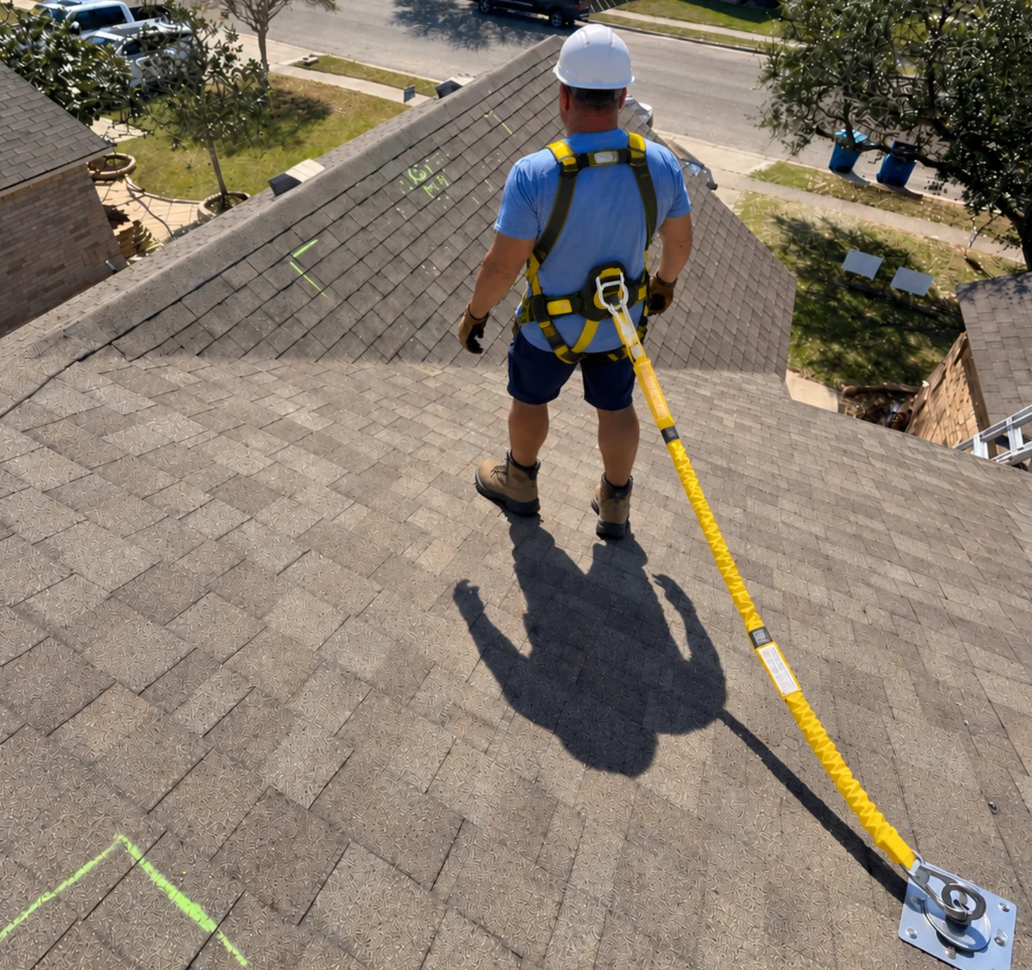 Roofer measuring a Texas roof for a replacement quote