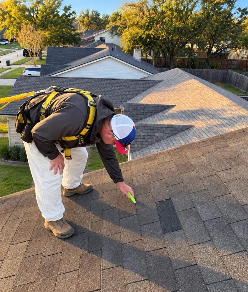 Flagstone Roofing team member reviewing a roof inspection report with a homeowner