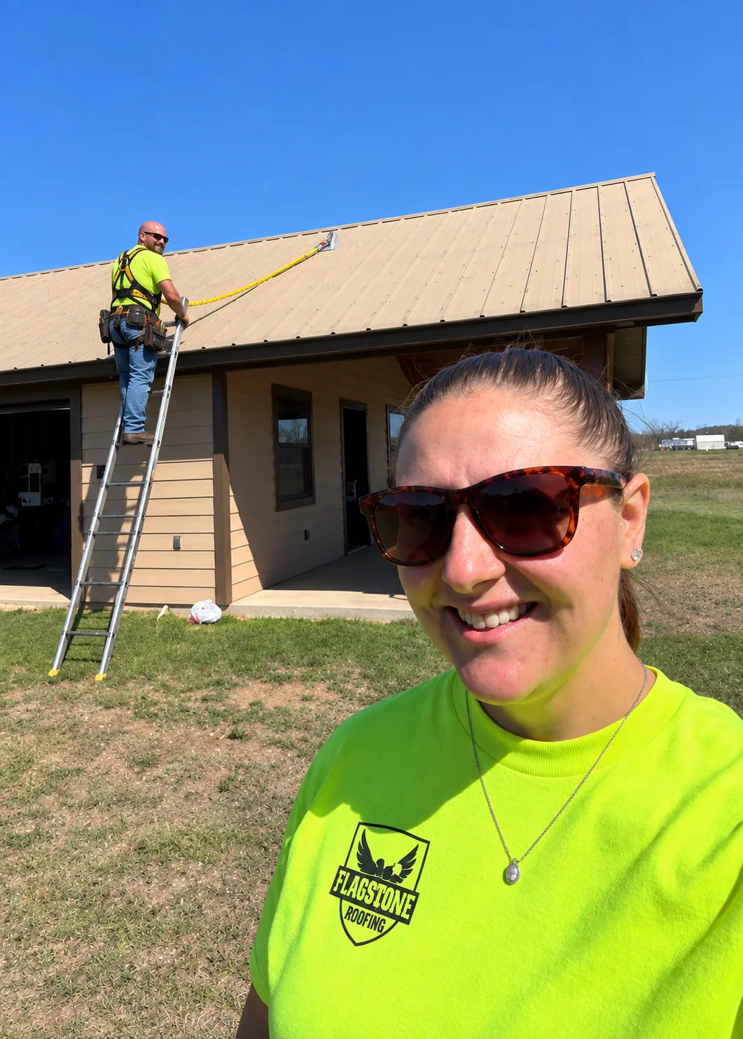 Roofer comparing a new shingle against weathered shingles